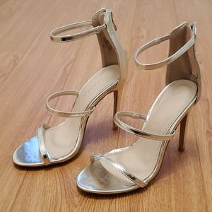 Gold high heeled strap sandals